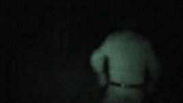 GIF from Entry 76. Masky walks away in to the darkness.