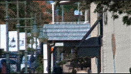 GIF from Entry 52. Tim walks down a sidewalk, away from the camera.